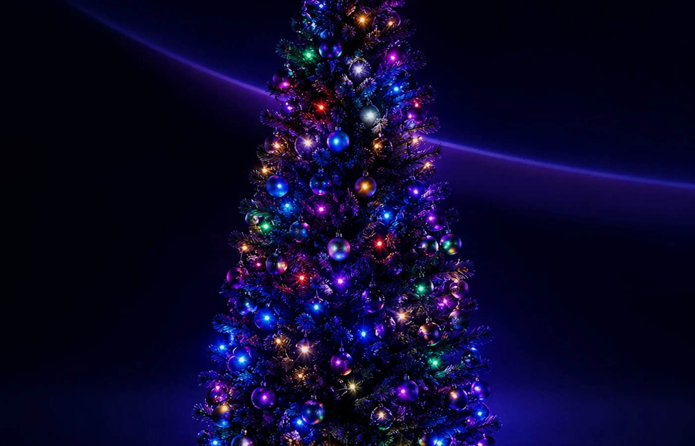 A Christmas tree wrapped in multicolour addressable LED lights against a dark background.
